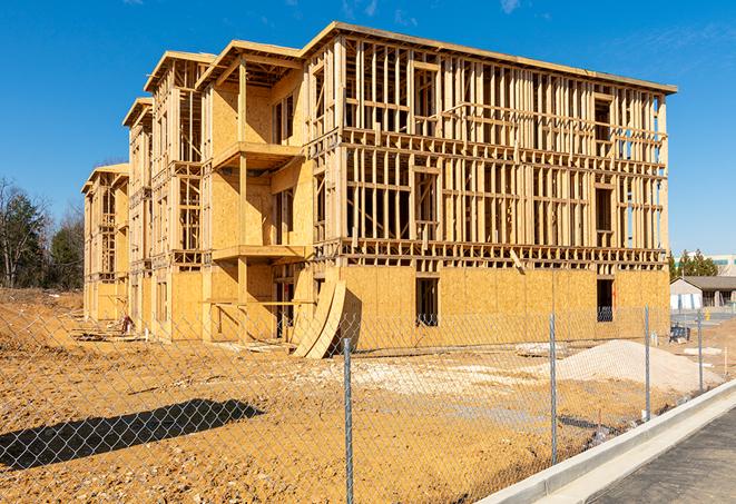 a tall, temporary chain link fence installed to protect a building site from unauthorized entry in Cedar Lake, IN